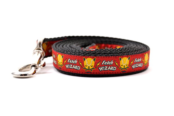 Small red dog leash - with words Fetch Wizard - and tennis ball icon with lightening bolts.