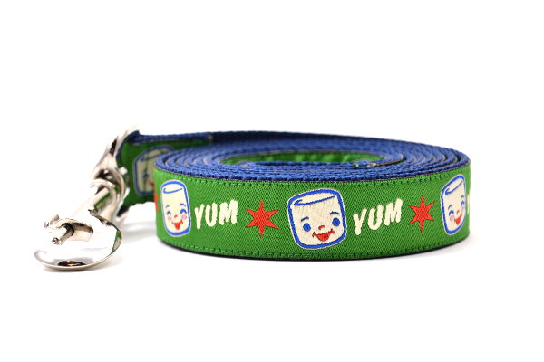 Large Green dog leash with Marshall the Marshmallow.  Marshall is shown smiling and giggling. The design also includes the word YUM.