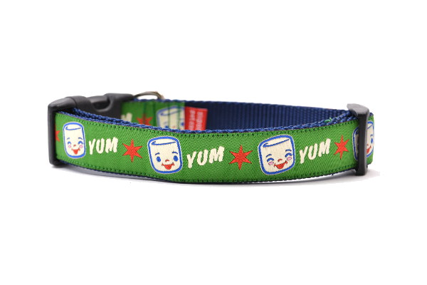 Medium Green Dog collar with Marshall the Marshmallow.  Marshall is shown smiling and giggling. The design also includes the word YUM.