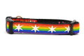 XS dog collar with Rainbow Flag Stripes and white six pointed stars around the collar.