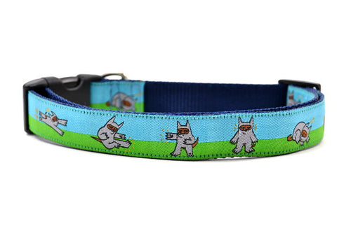 Dog collar that is half blue and half green with a dog dressed in a Ninja Suit.  The dog is shown in various tai chi positions.