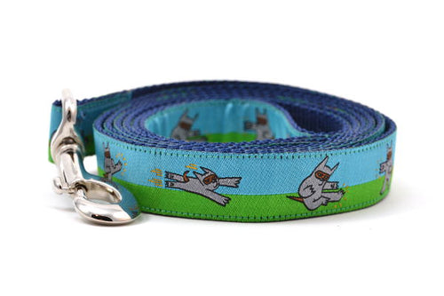 Dog leash that is half blue and half green with a dog dressed in a Ninja Suit.  The dog is shown in various tai chi positions.
