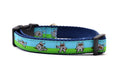 Small Dog collar that is half blue and half green with a dog dressed in a Ninja Suit.  The dog is shown in various tai chi positions.