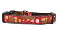 XS burgundy dog collar with chamomile flowers, stars, and half moon design.