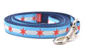 Small dog leash with two light blue stripes and one white stripe and red six pointed stars - representing the Chicago Flag.