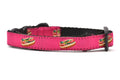 One raspberry cat collar with design that depicts chicago style hot dog.