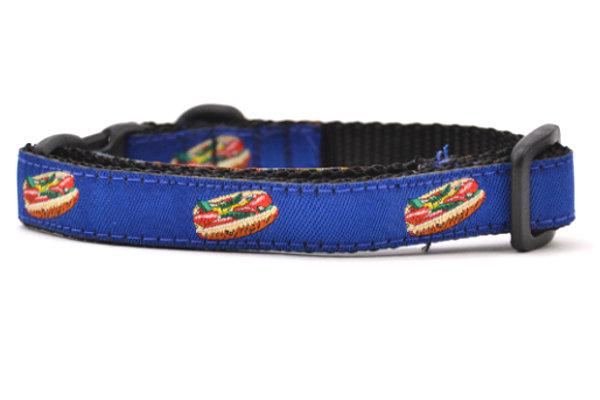 One navy cat collar with design that depicts chicago style hot dog.