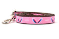 Picture shows pink dog leash with images of angel wings and words earth angel.