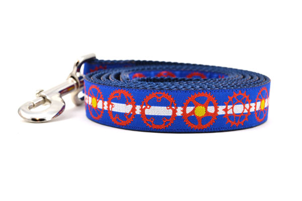 Large dog leash blue and white stripes and red bicycle sprockets - some filled in with yellow dots - representing the Colorado State Flag.