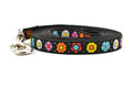 XS black dog leash with daisy chain pattern and colorful daisy flowers.