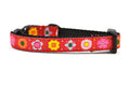 XXS red dog collar with daisy chain pattern and colorful daisy flowers.