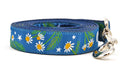 Large dark teal dog leash with chamomile flowers, stars, and half moon design.