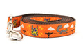 One large orange dog leash - design includes squirrels running on telephone wires and squirrel in lucha libre mask.  The mask is purple and yellow with electrical sparks coming from the mask.