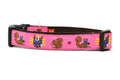 Medium pink dog collar - design includes squirrel in lucha libre mask with a yellow flower behind it and a tulip on the mask.  One small squirrel with a tulip in its mough and one with a tulip bulb.  Also, a six pointed star.
