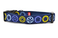 Medium navy dog collar with light blue, yellow, and purple bicycle sprockets.