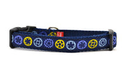 Small navy dog collar with light blue, yellow, and purple bicycle sprockets.