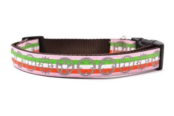 Large pink dog collar with light green, white, and red stripe and bicycyle sprockets in gray.