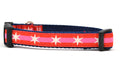 Small dog collar with 2 outer red stripes and 1 pink stripe in the middle and white six pointed stars around the collar.