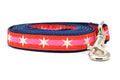 Small dog leash with 2 outer red stripes and 1 pink stripe in the middle and white six pointed stars around the collar.