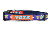 Small dog collar that is purple and orange blocks pattern with the word VOTE on each color block. 