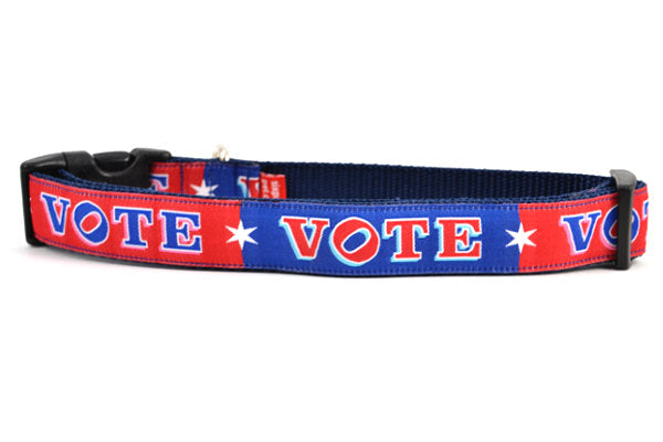 Large dog collar that is red and navy blocks pattern with the word VOTE on each color block. 