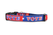 XS dog collar that is red and navy blocks pattern with the word VOTE on each color block. 